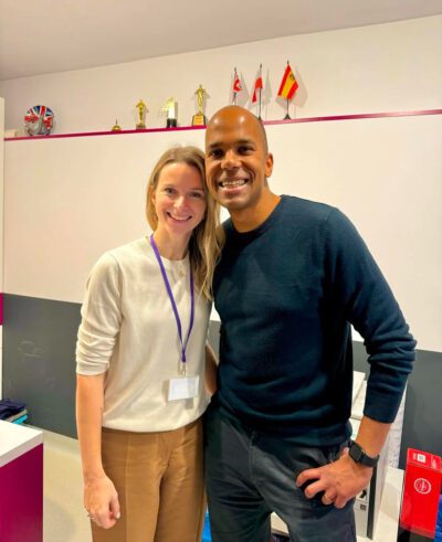 School owner and recruiter standing together and smiling in a school in Warsaw